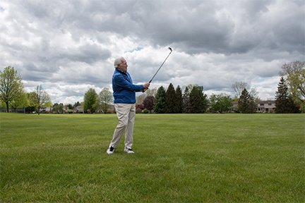 Stephen swinging a golf club