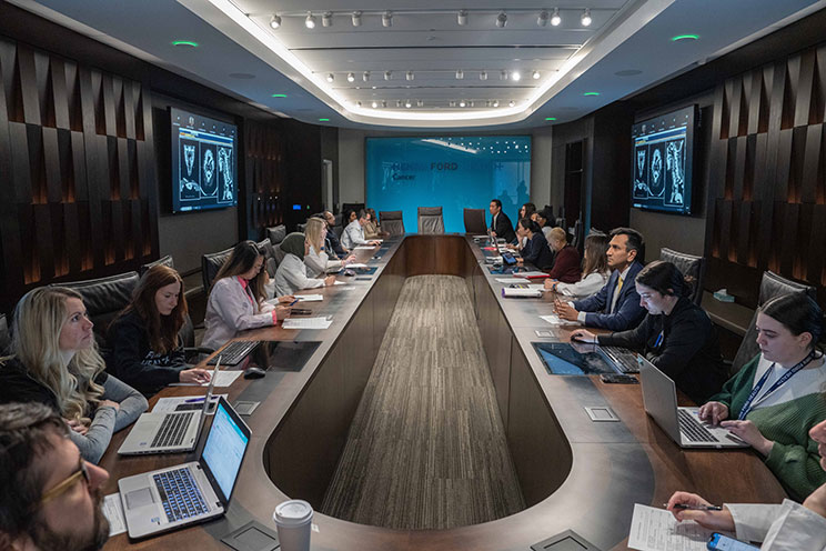 A tumor board at Henry Ford Health reviews patient cases to create personalized cancer treatment plans for patients in the Metro Detroit area.