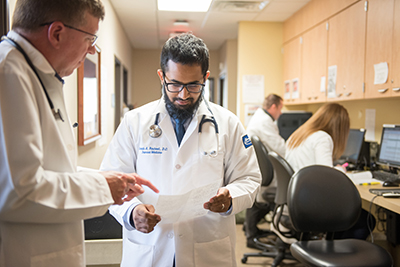 resident reviewing report