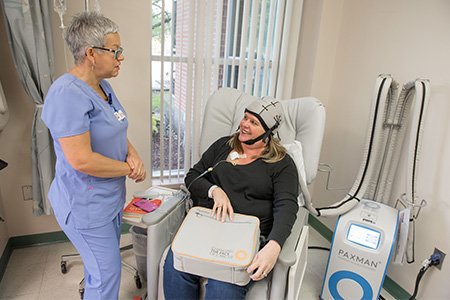 breast cancer patient laura using cool cap technology to prevent hair loss during chemotherapy