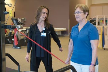 rehab patient using stretch band