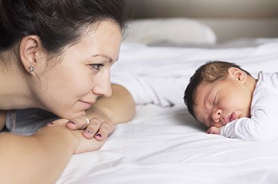 mom looking at baby