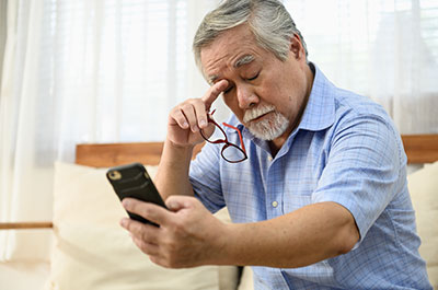 man trying to read phone