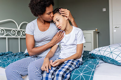 mother consoling child