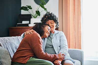 daughter hugging mother