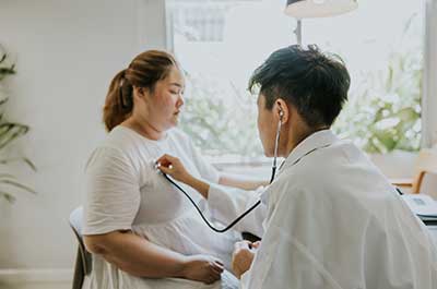 overweight woman at doctor