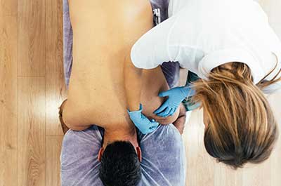 person getting acupuncture