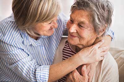 daughter embracing mother