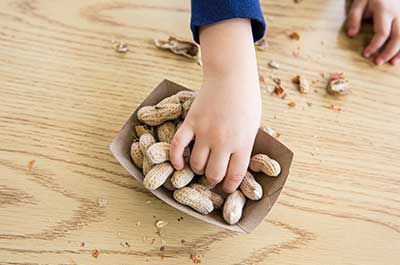 boy eating peanuts