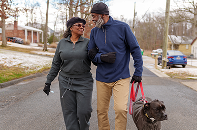 older couple walking outside