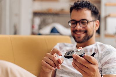 man checking blood sugar