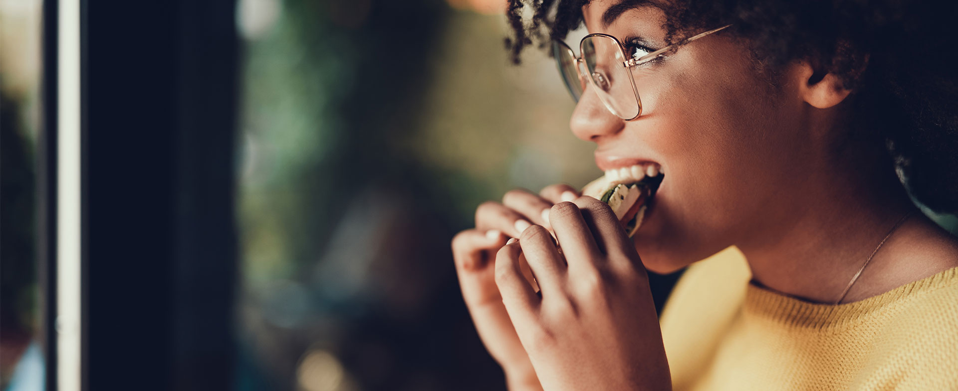 woman eating sandwich