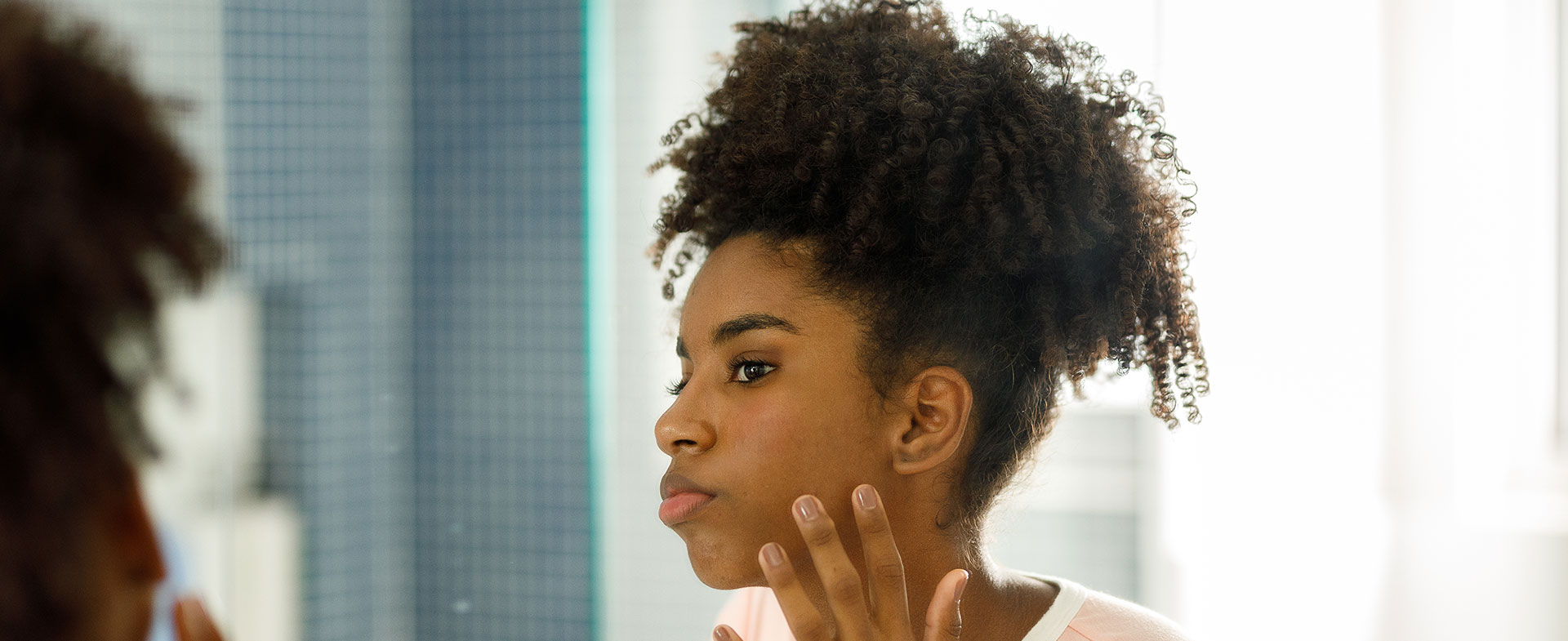 girl looking in mirror