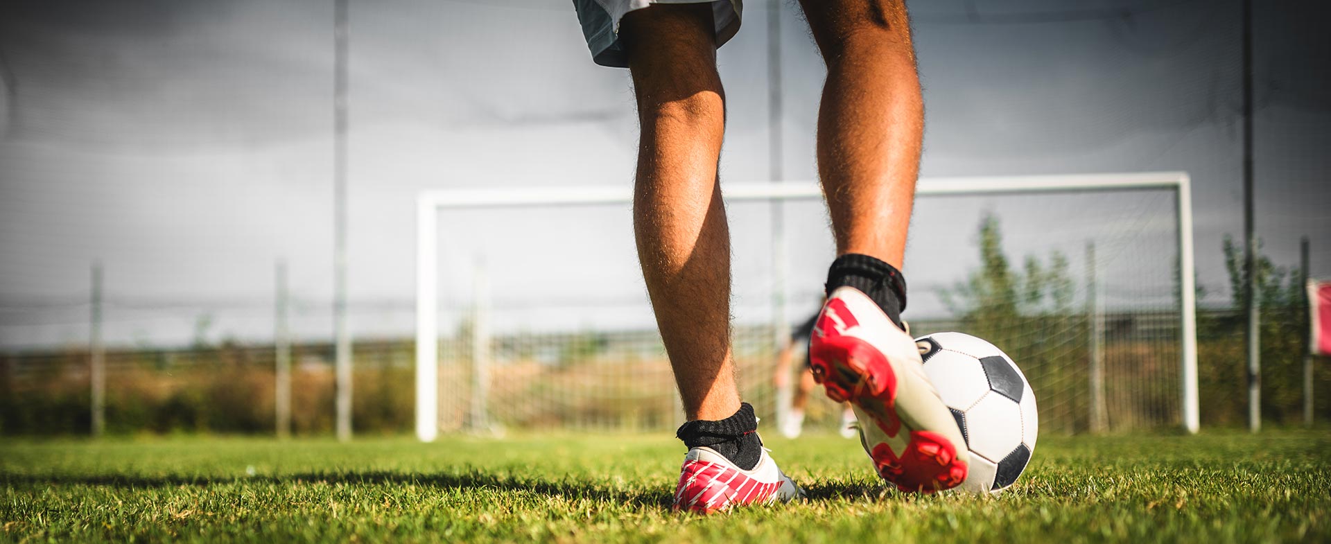 soccer player kicking ball