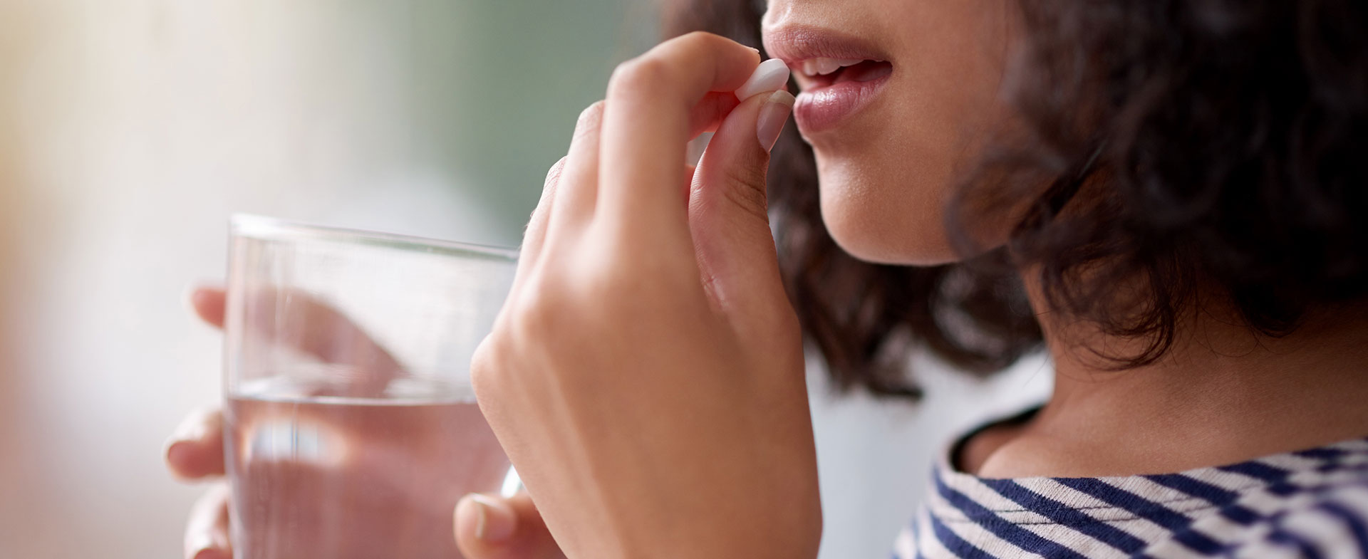 woman taking supplement