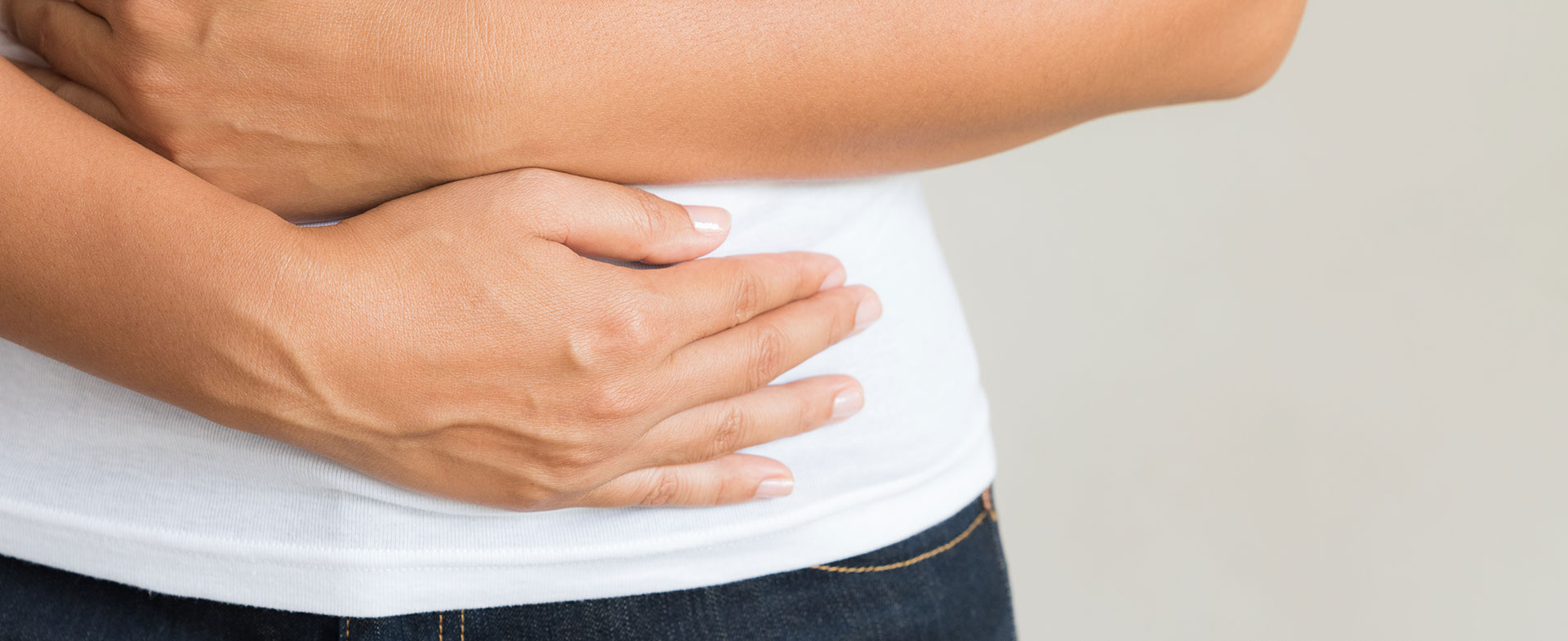 woman holding stomach