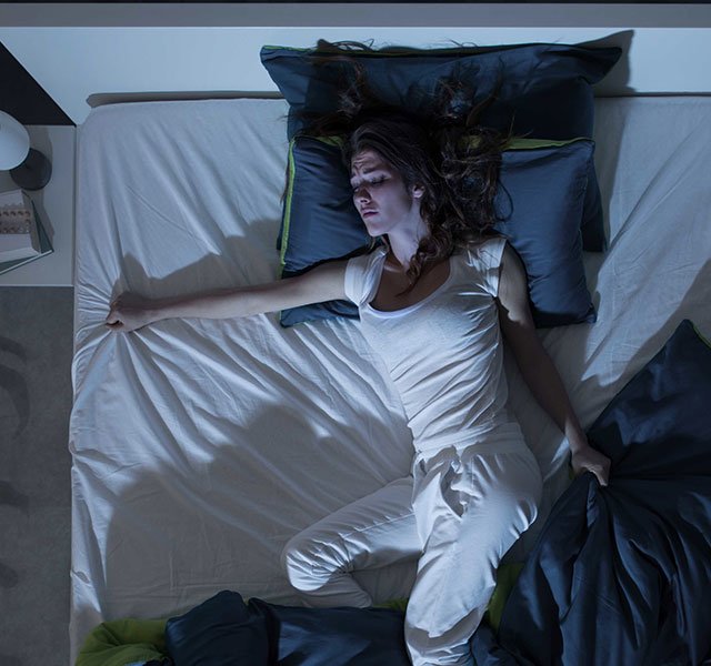 woman sleeping in bed