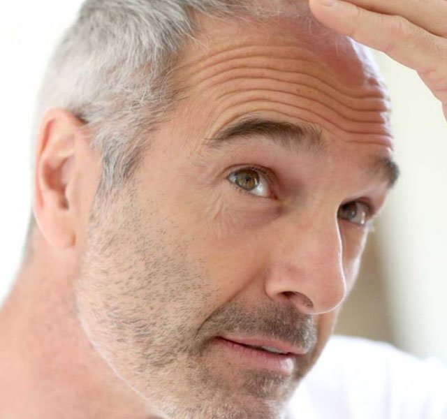 man looking in mirror