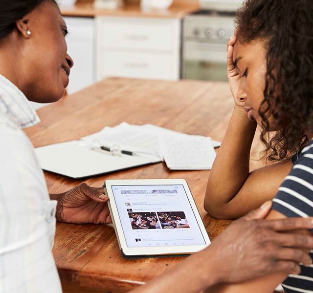 mother and daughter sitting together