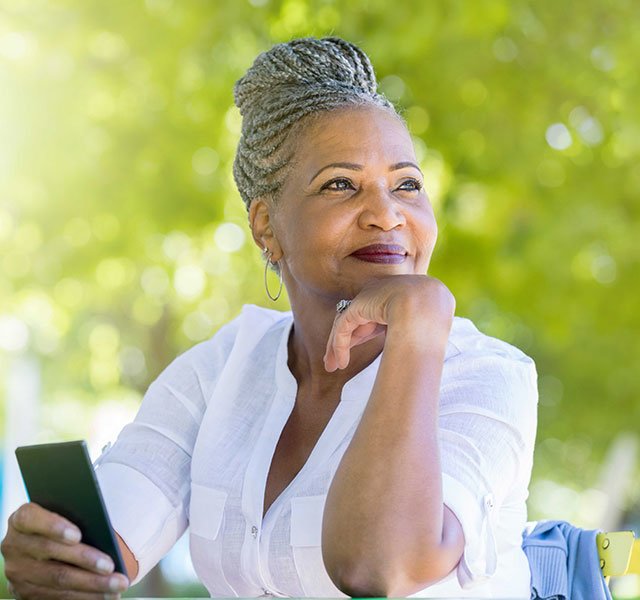 woman holding a cell phone