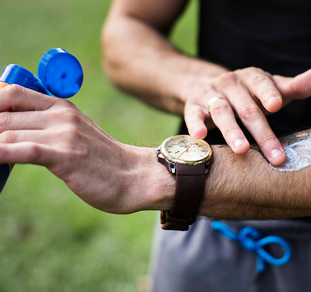 Man using sunscreen mobile banner