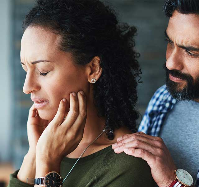 Man comforting woman after miscarriage