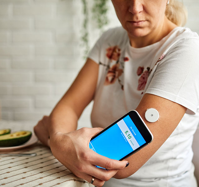 woman checking blood sugar