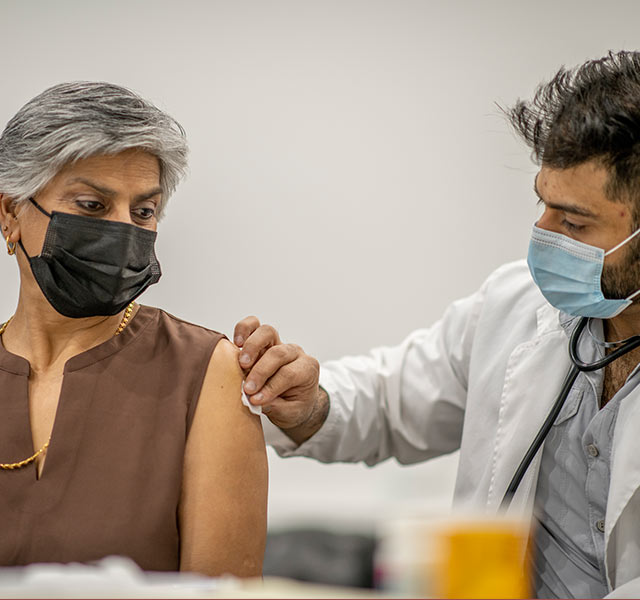 woman getting vaccine