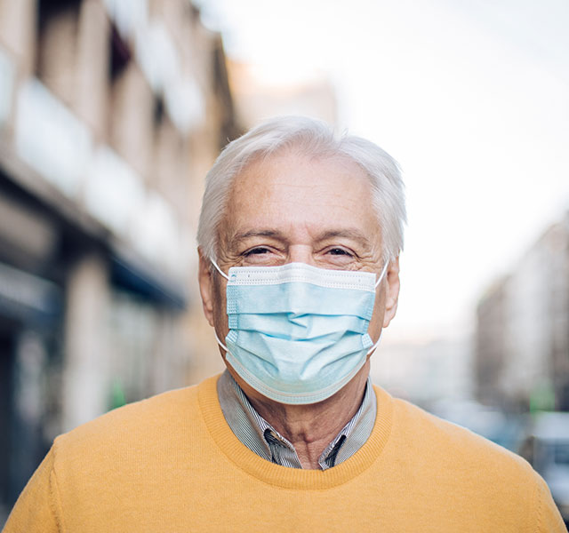 older man wearing mask