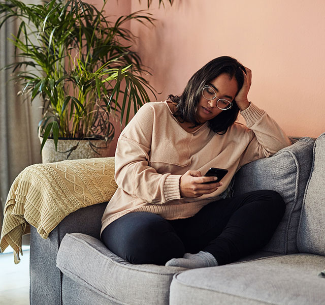 woman scrolling through phone