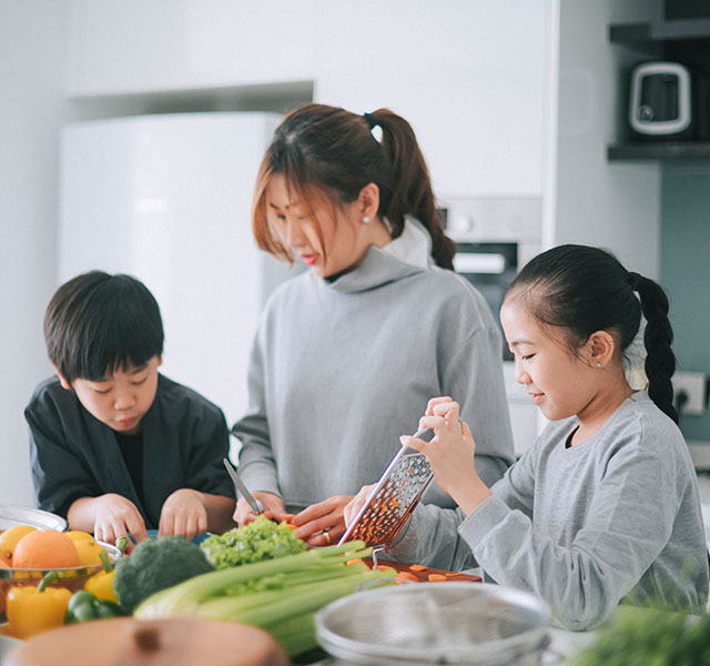 mom and children cooking