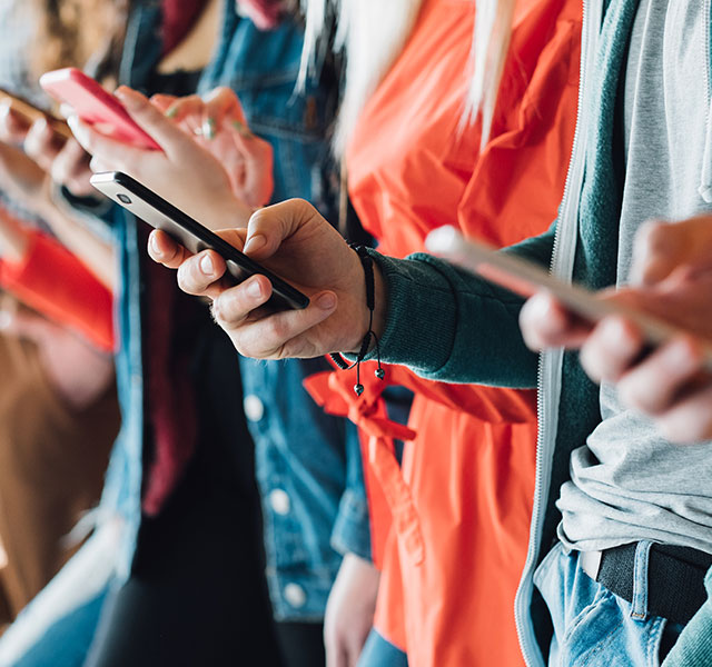 people on their phones