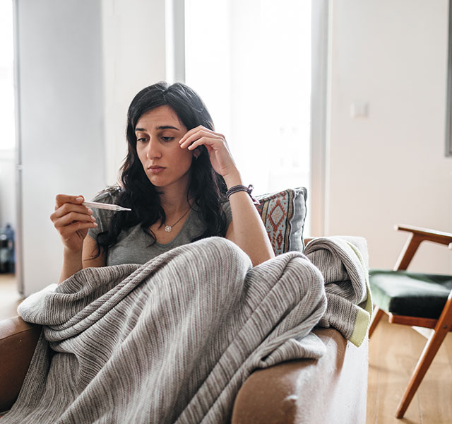 woman reading thermometer