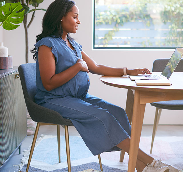 pregnant woman at computer