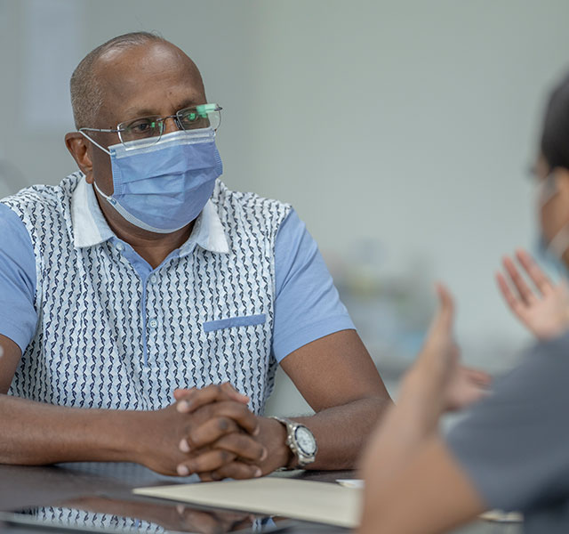 patient talking to doctor