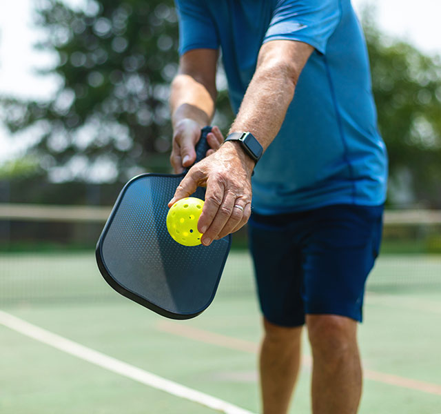 man playing pickleball
