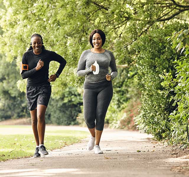 two women running