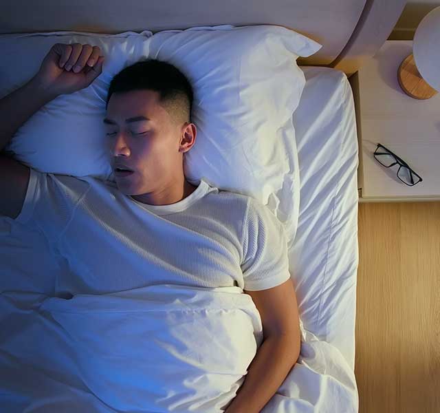 man snoring while sleeping