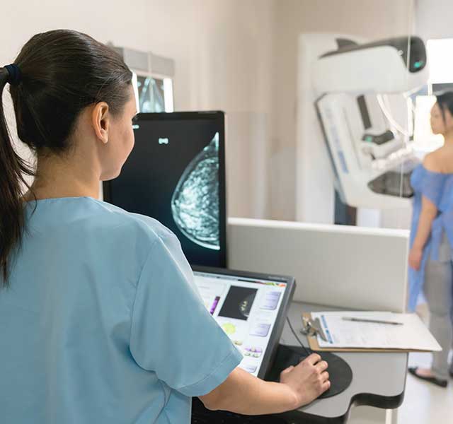 woman getting mammogram