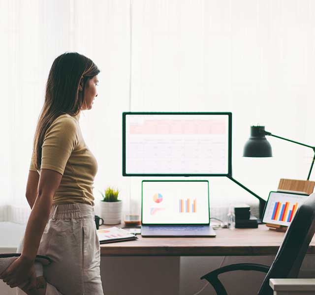 woman stretching at desk