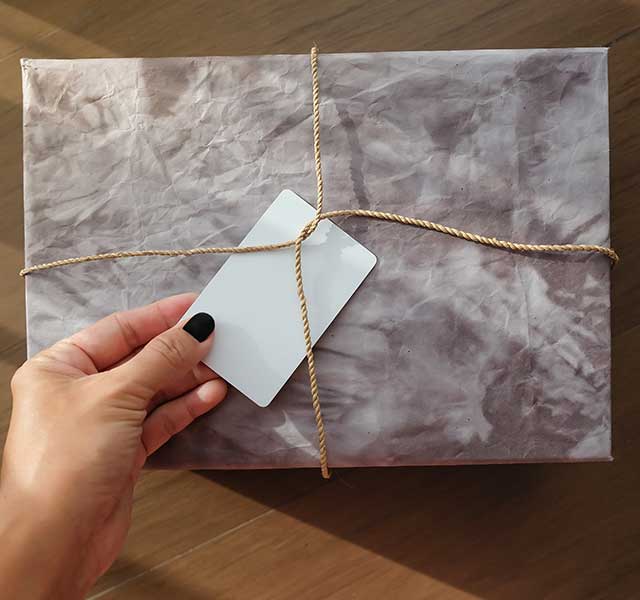 person wrapping gift