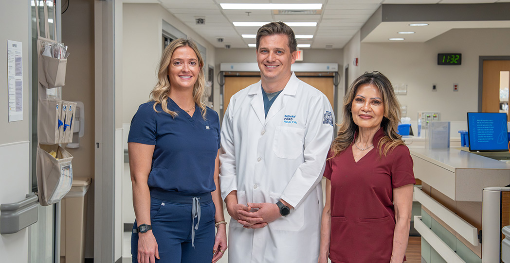 henry ford health doctors posed in hospital hallway