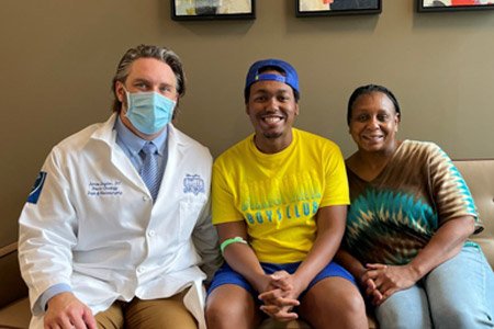 Austen with his mom and doctor