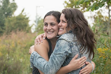 brain tumor patient sasha and danielle hugging