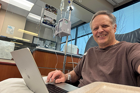 head and neck cancer patient joe smiling in the hospital bed