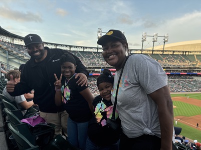 Family at Tigers game with Game On Cancer kids club.