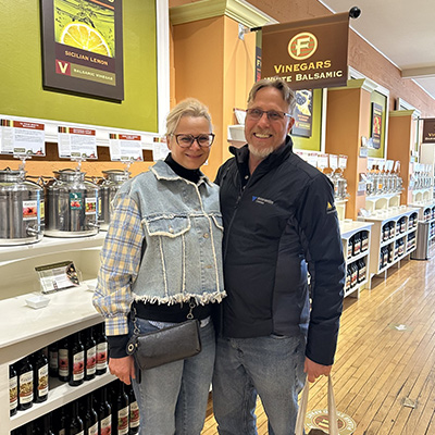mike and his wife shopping at a vinaigrette store