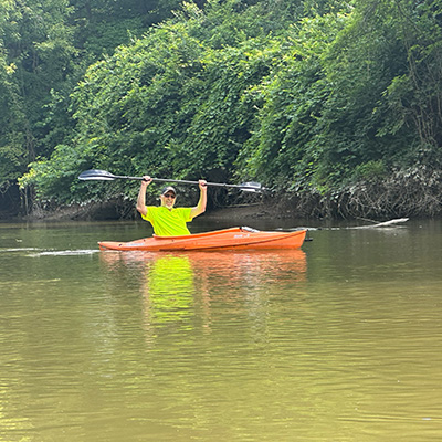 mike rowing in a kayak on the river