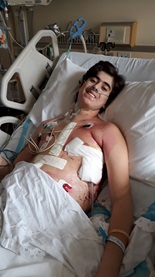 Mohamed El-Souri laying in hospital bed 