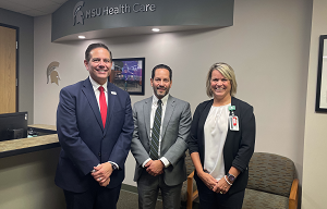 Photo of Steven Kalkanis, left, CEO of the Henry Ford Medical Group and Henry Ford Hospital, Seth Ciabotti, CEO of MSU Health Care and Kris Alle, COO of MSU Health Care. 